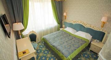 Фото номера Стандартный двухместный номер с 1 кроватью Отель Royal Olympic Hotel г. Киев 2
