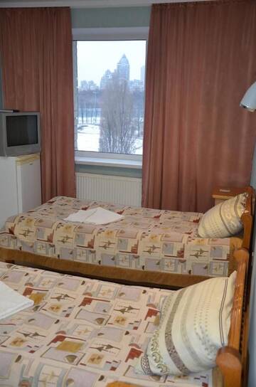 Фото номера Стандартный двухместный номер с 2 отдельными кроватями и общей ванной комнатой Мини-отель Hotel Trias г. Киев 4