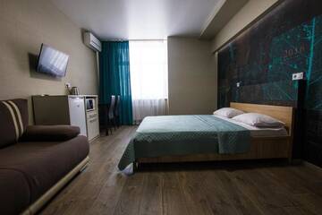 Фото номера Улучшенный номер с диваном Апартаменты Solo Apartment Ahmatovoy г. Киев 21
