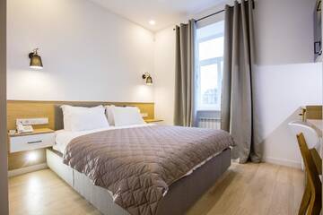 Фото номера Номер Делюкс с кроватью размера «queen-size» Апартаменты Partner Guest House Baseina г. Киев 4