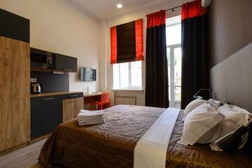 Фото номера Апартаменты с балконом Апартаменты Partner Guest House Baseina г. Киев 9