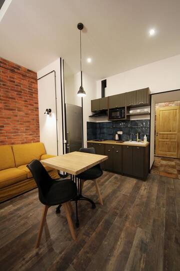 Фото номера Апартаменты-студио Апартаменты Loft Apartments on Desyatynnyi Ln г. Киев 7