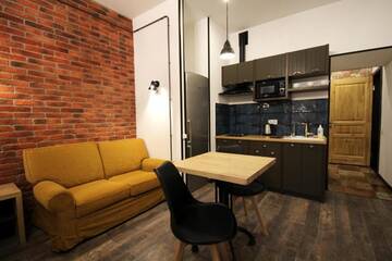 Фото номера Апартаменты-студио Апартаменты Loft Apartments on Desyatynnyi Ln г. Киев 14