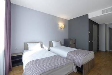 Фото номера Двухместный номер с 2 отдельными кроватями Отель Favor Sport Hotel г. Киев 14