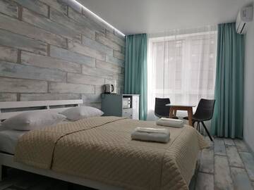 Фото номера Номер Делюкс с кроватью размера «queen-size» Апартаменты Solo Apartment Kamenskaya г. Киев 5