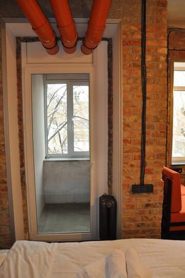 Фото номера Апартаменты с балконом Апартаменты Apartment Arena City Loft г. Киев 18